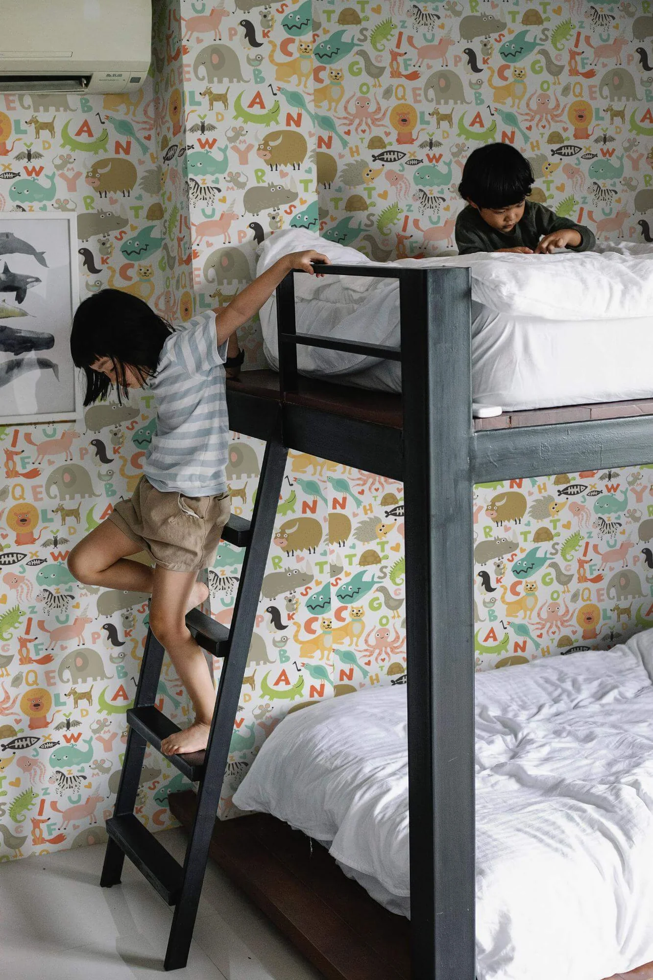Animal alphabet wallpaper in a room setting: a pastel animal alphabet with soft green accents