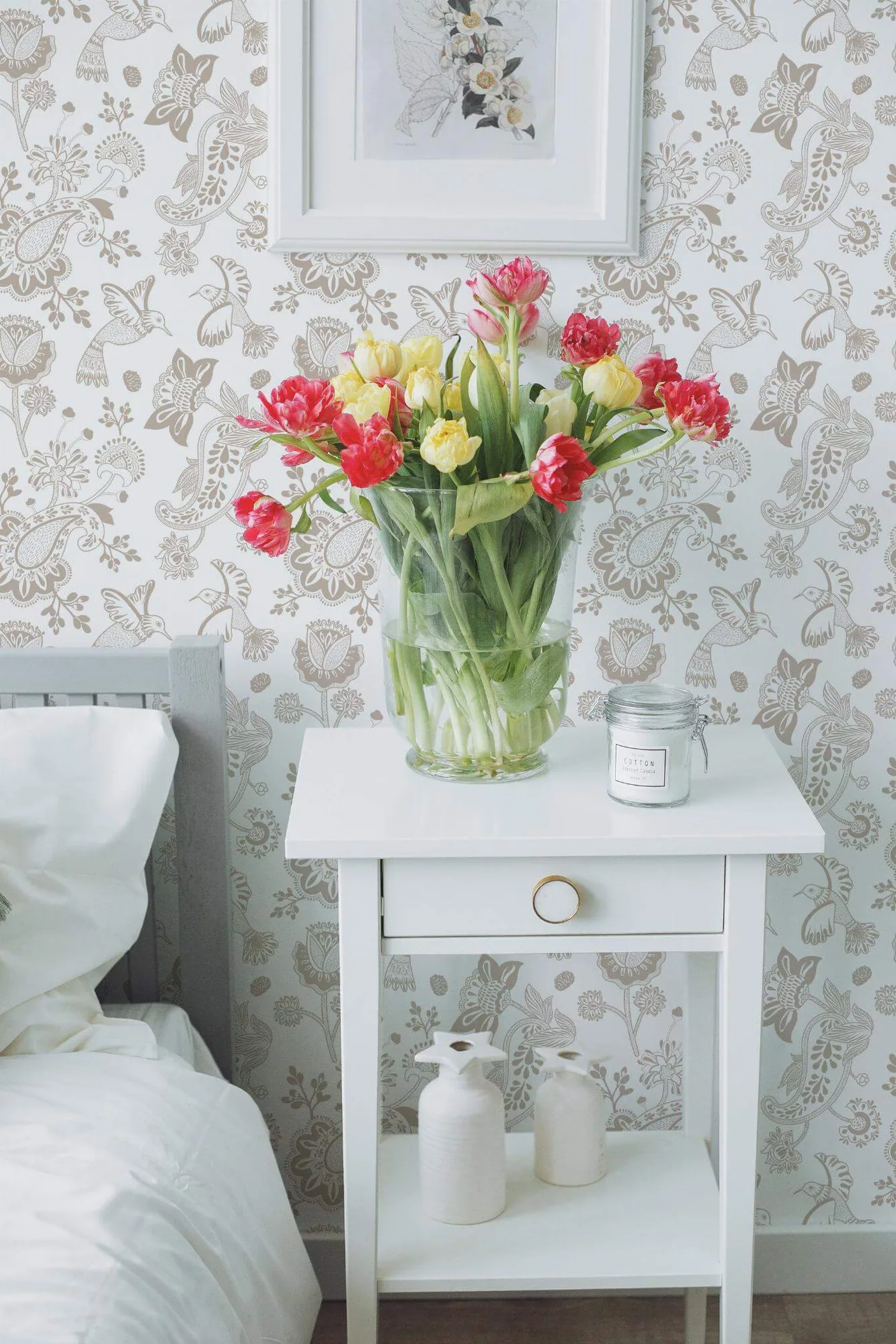 Beige paisley wallpaper in a room setting: fine beige paisley, birds, and flowers make a light white-ground repeat