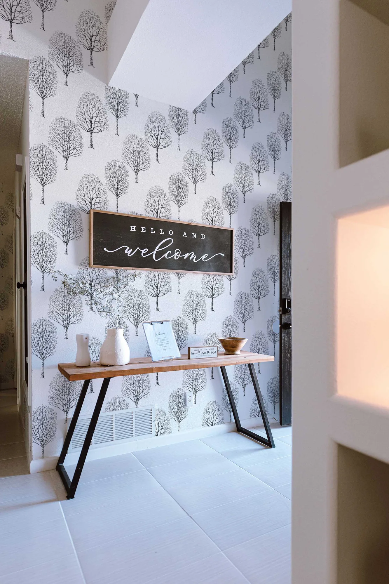 Birch Calm wallpaper in a room setting: minimalist black-and-white birch silhouettes
