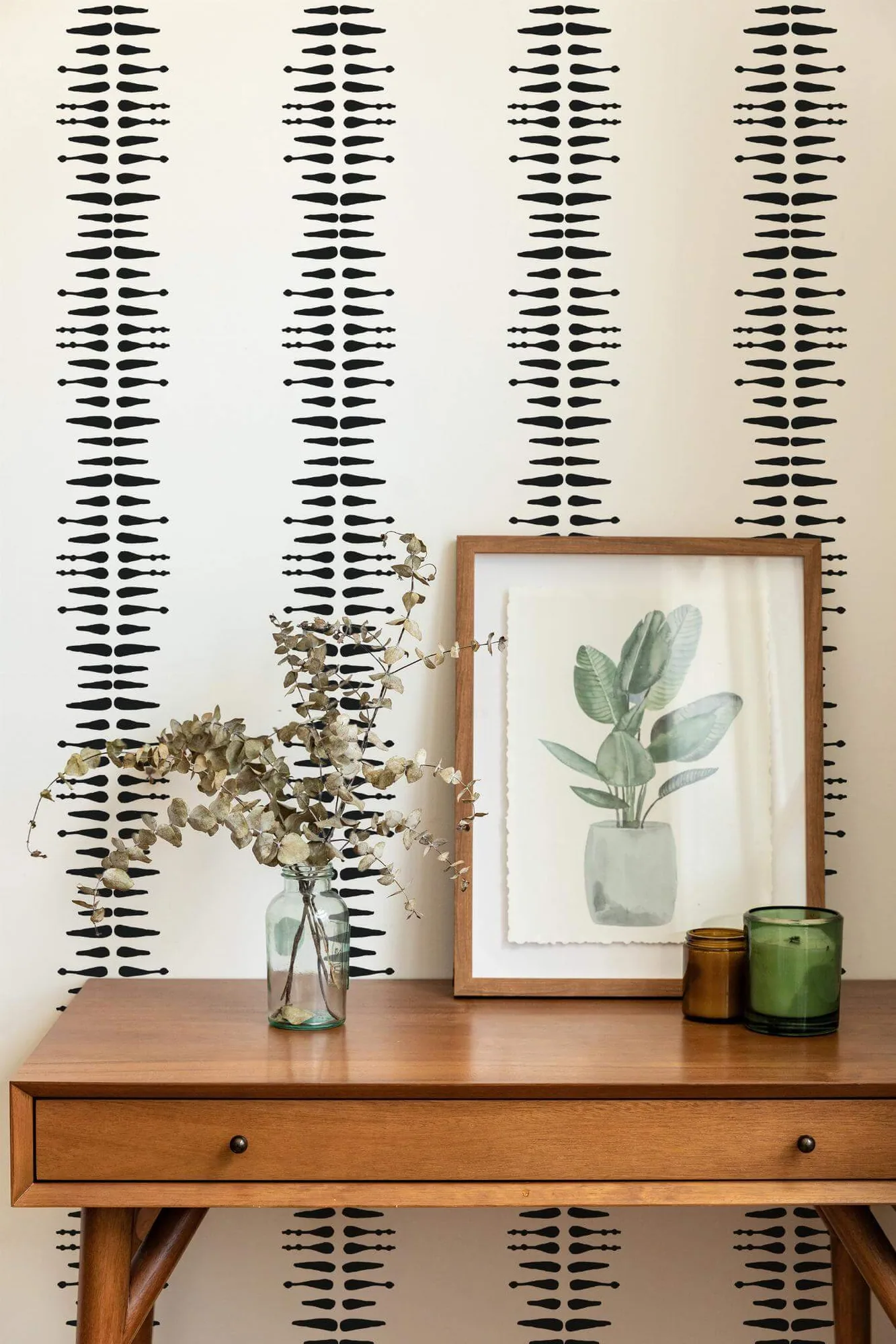 Boho stripe wallpaper in a room setting: broken black brush marks stack into narrow vertical stripes on white