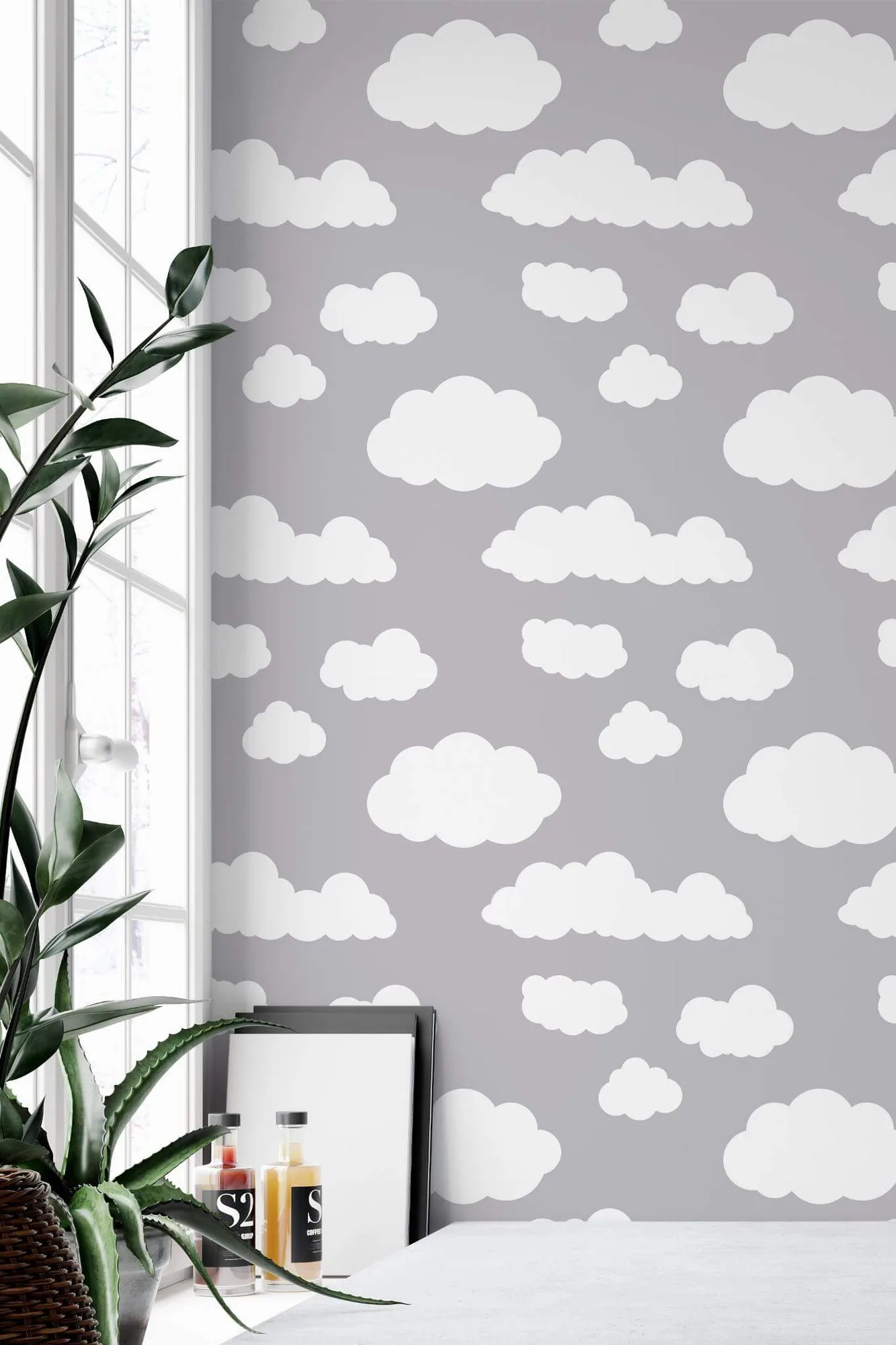 Clouds wallpaper in a room setting: rounded white clouds drift across a soft gray ground
