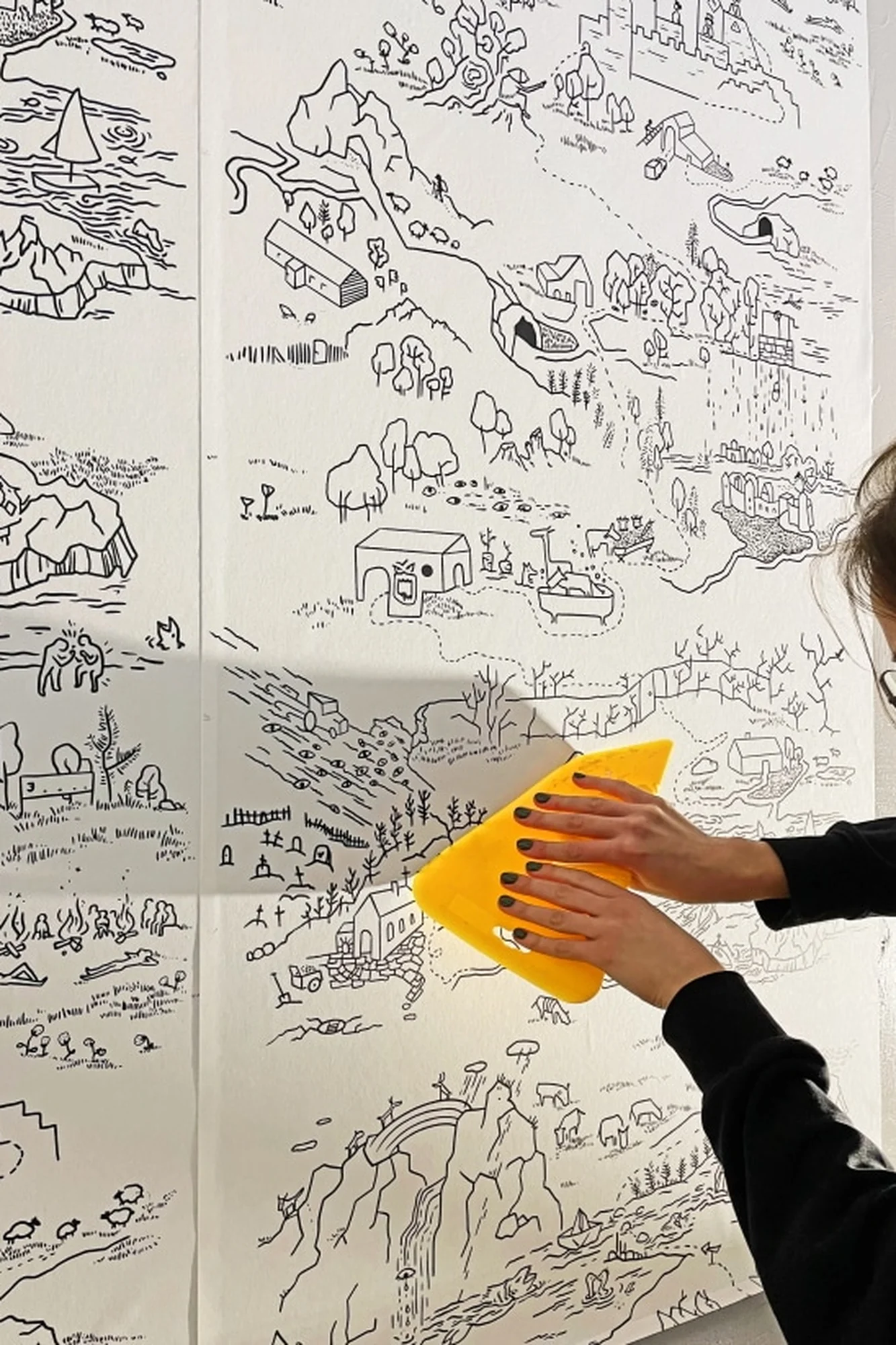 Fairytale map paintable wallpaper pattern close-up: a black-and-white fairytale map made to be colored in by little artists