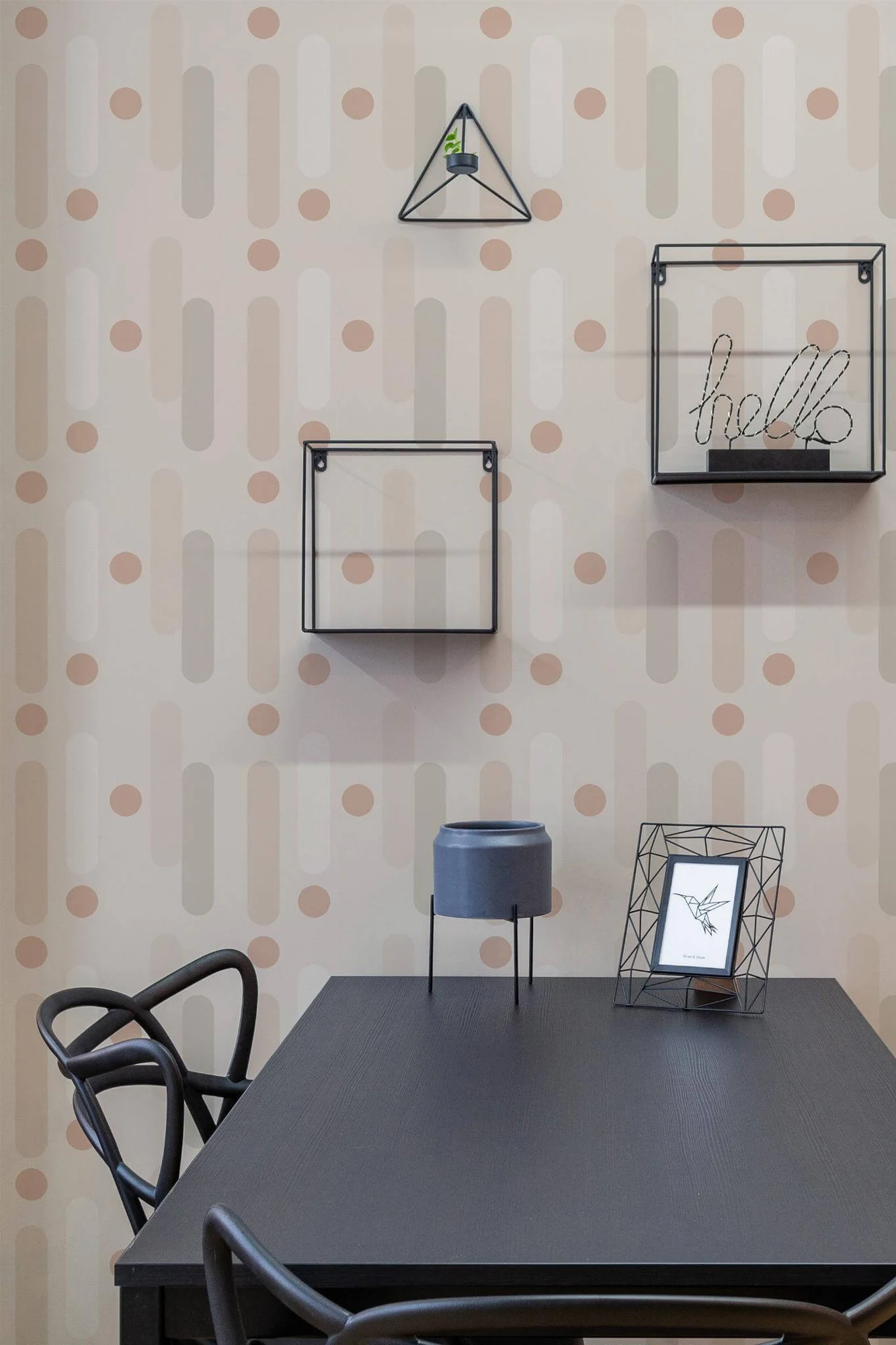 Neutral geometric wallpaper in a room setting: rounded vertical forms and small circles in a soft warm palette