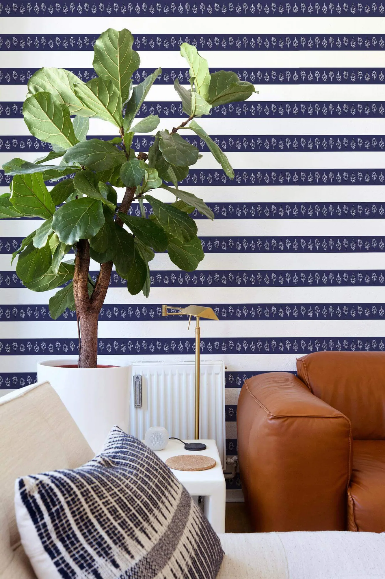 Oak leaf stripe wallpaper in a room setting: navy bands alternate with slim rows of white oak-leaf motifs