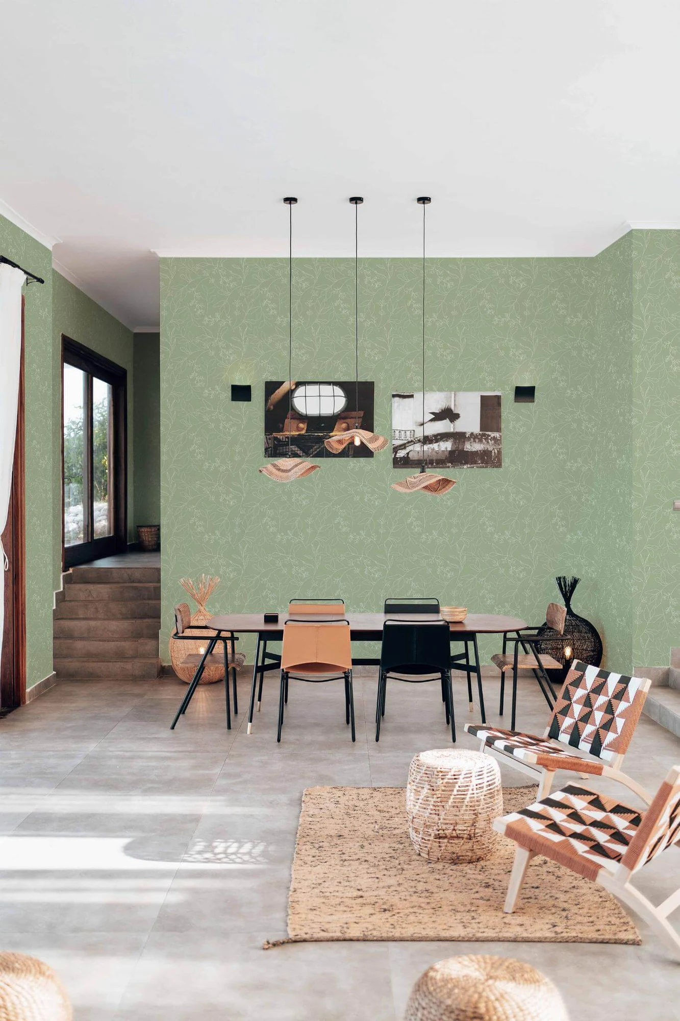 Sage green leaf wallpaper in a room setting: fine white leaf outlines on sage green