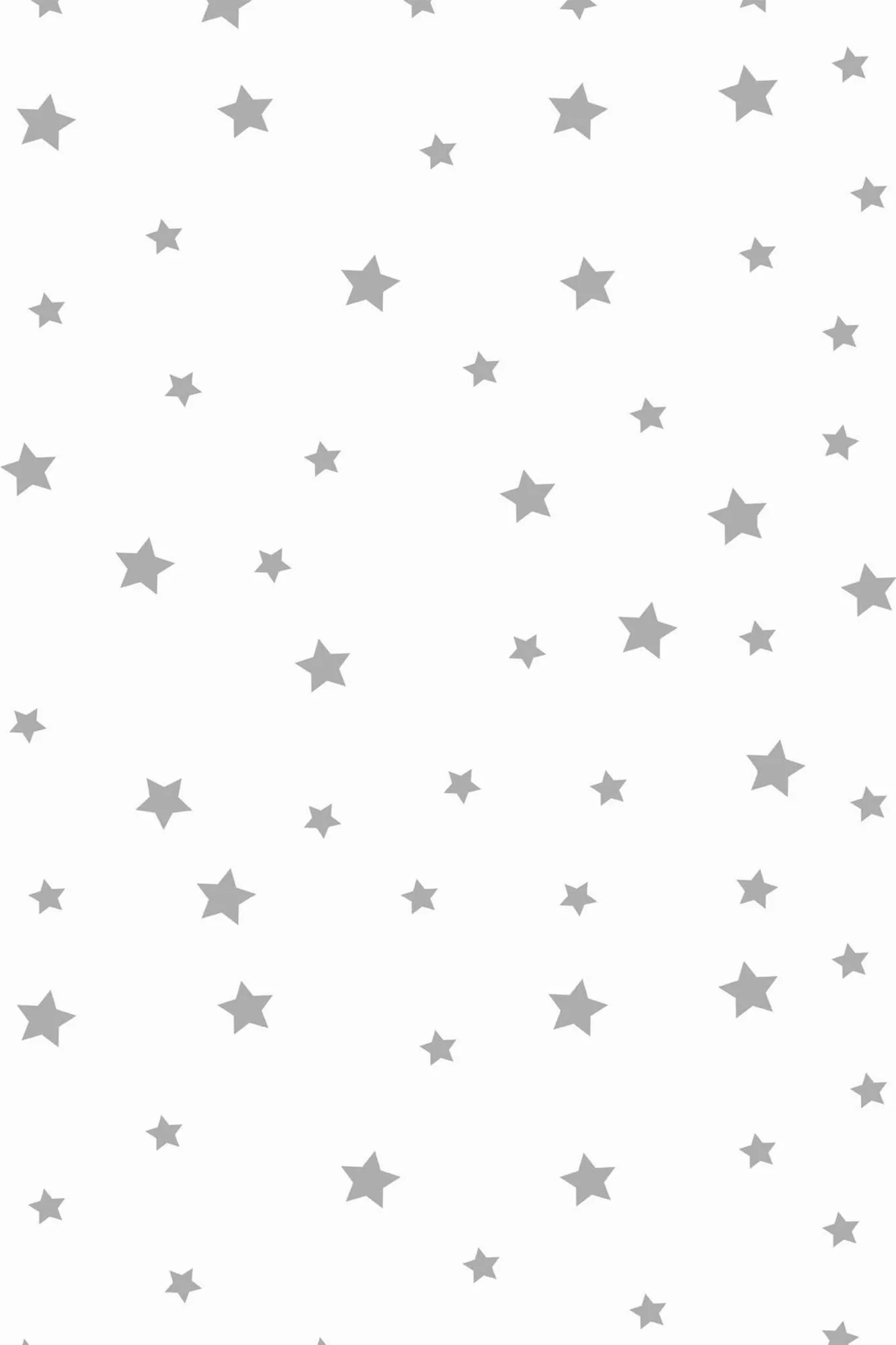Stars wallpaper pattern close-up: small gray stars are scattered evenly across white