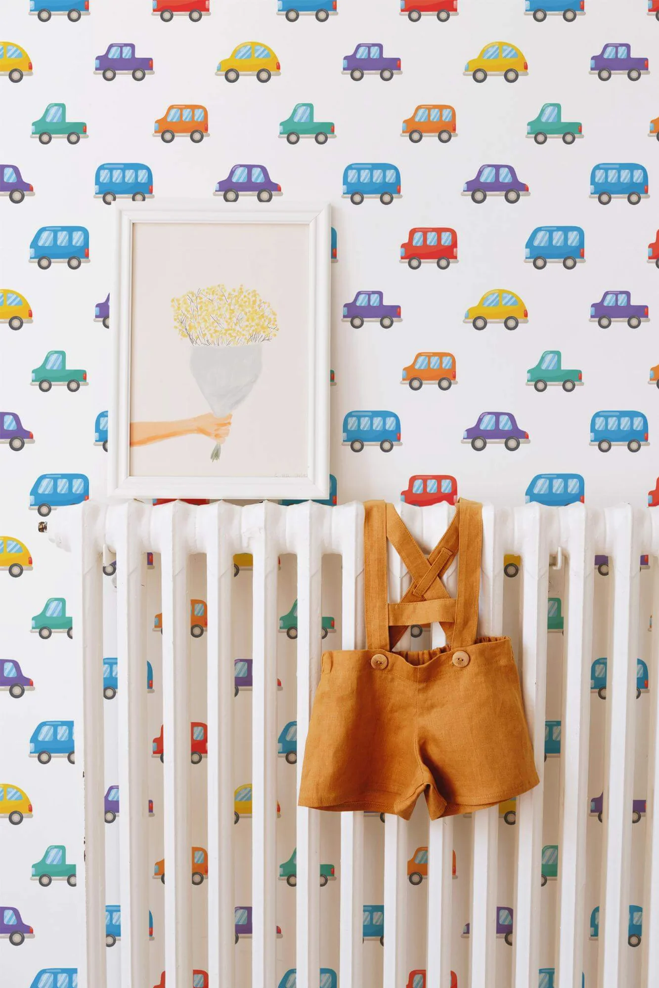 Toy car wallpaper in a room setting: cheerful little cars with sunny yellow accents on white